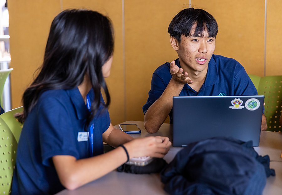 youth discussing topic with colleague