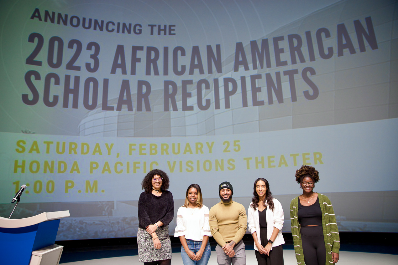 Four African American Scholarship Recipients on Pacific Visions Theater stage.