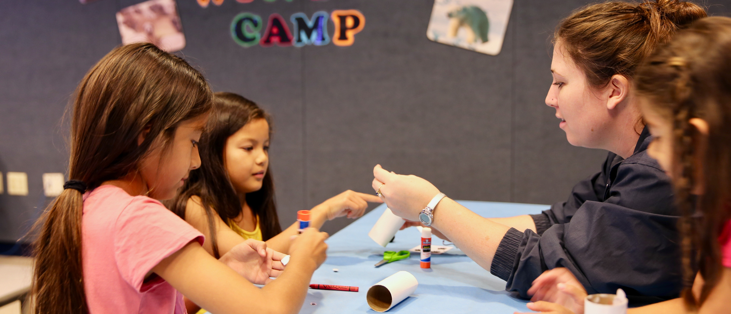 two kids crafting with aquarium educator